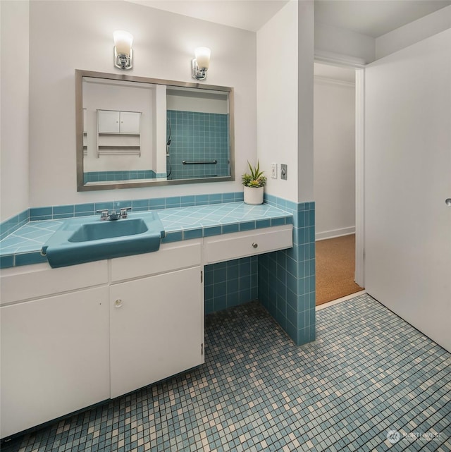 1600 43rd Ave E Unit 204, Seattle, WA 98112 - bathroom with vanity and tile patterned flooring