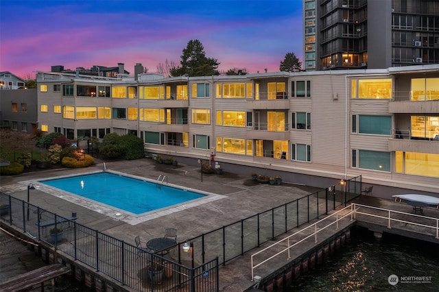 1600 43rd Ave E Unit 204, Seattle, WA 98112 - pool at dusk featuring a patio area