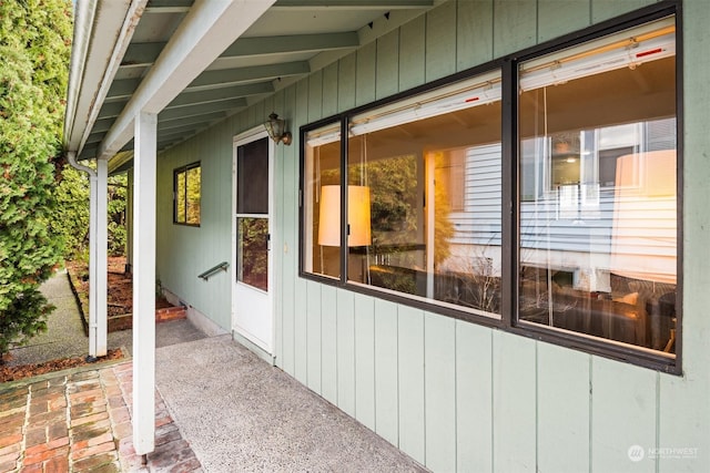 view of side of property featuring a patio area