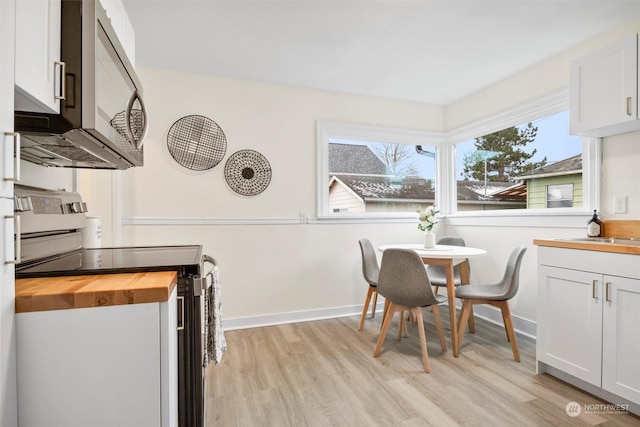 dining area with light hardwood / wood-style floors