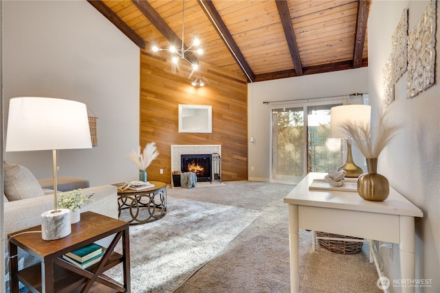 carpeted living room with wood ceiling, beam ceiling, high vaulted ceiling, and wood walls