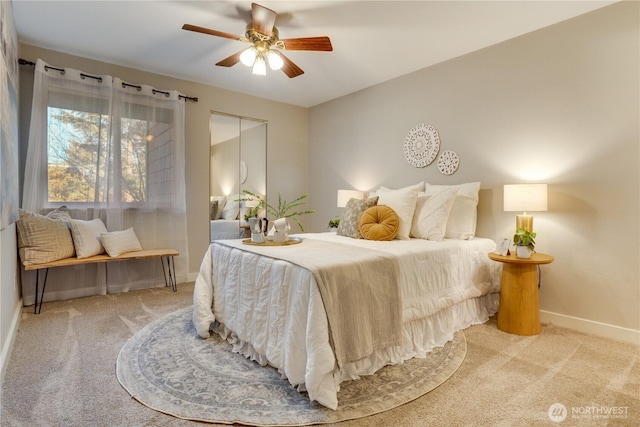 carpeted bedroom with ceiling fan