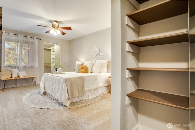 carpeted bedroom featuring ceiling fan