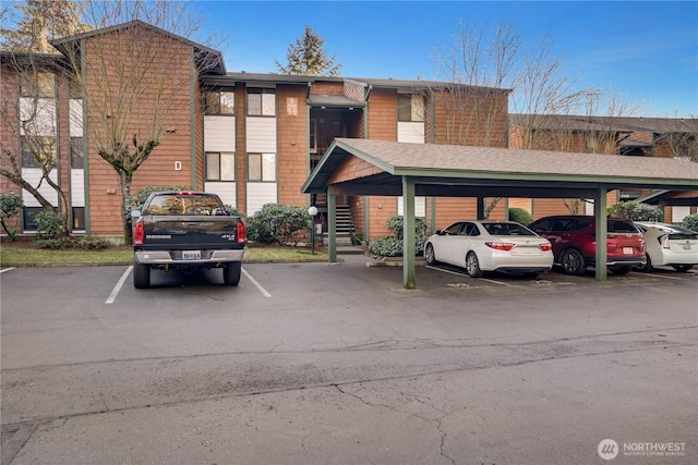 view of parking / parking lot with a carport