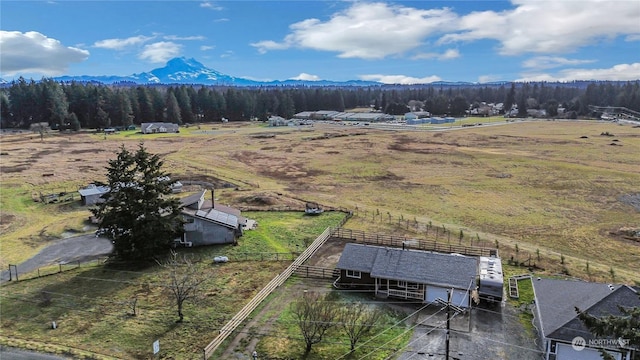 drone / aerial view featuring a rural view, a mountain view, and a wooded view