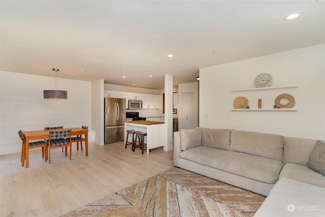 living room with light hardwood / wood-style floors