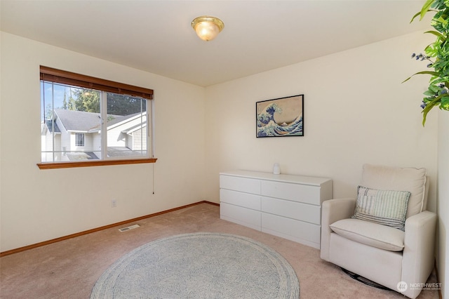 living area with light carpet