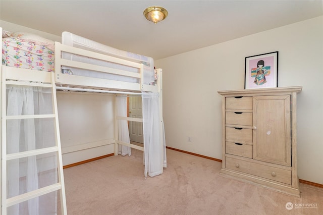 unfurnished bedroom featuring light colored carpet