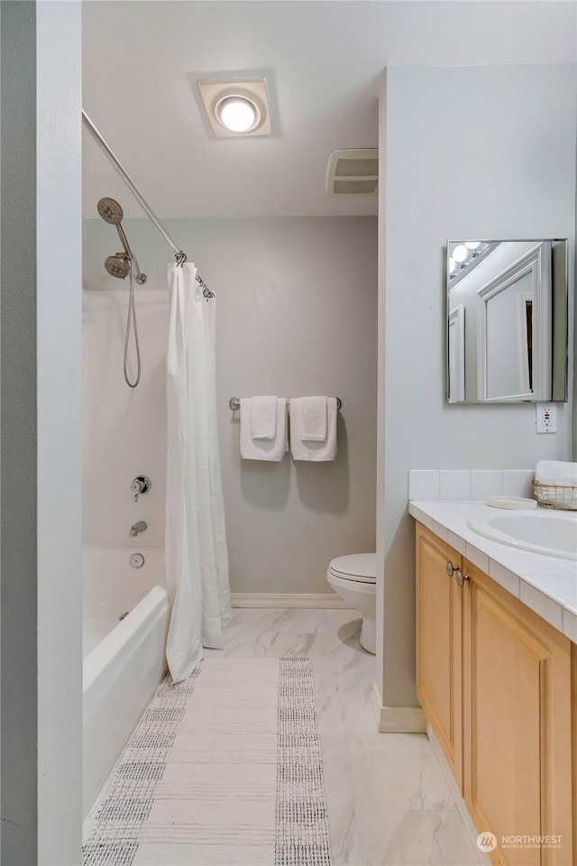 full bathroom featuring vanity, toilet, and shower / bath combo with shower curtain