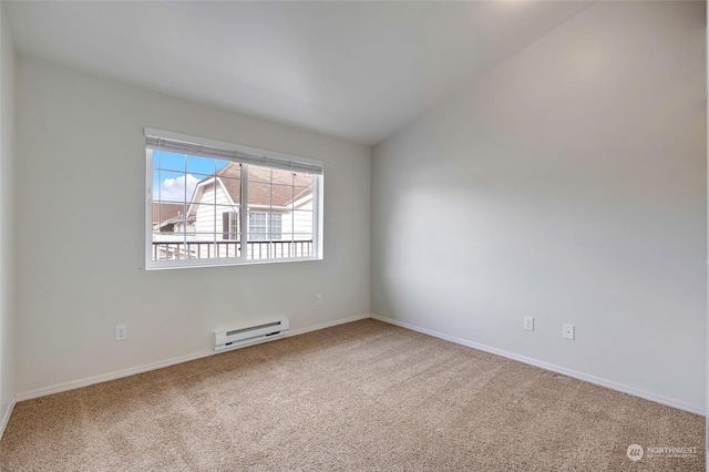 carpeted empty room with vaulted ceiling and baseboard heating