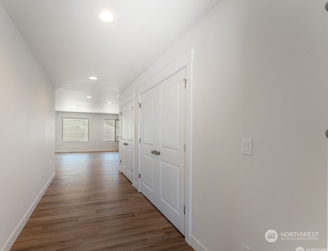 corridor with dark wood-type flooring