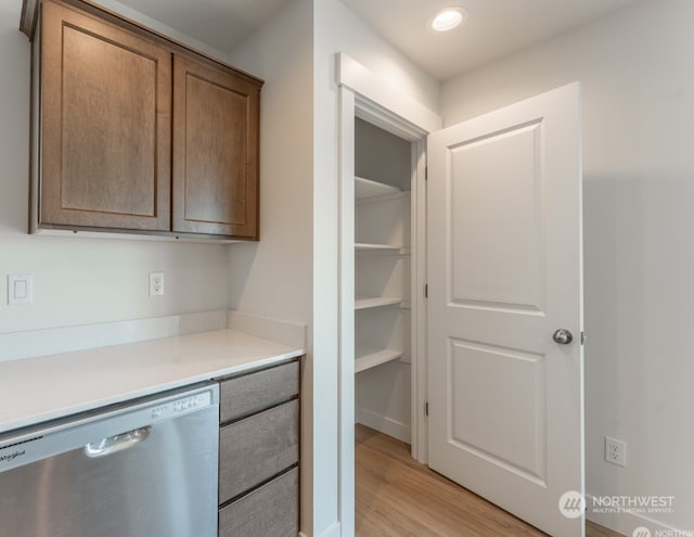 interior space with dishwasher and light hardwood / wood-style floors