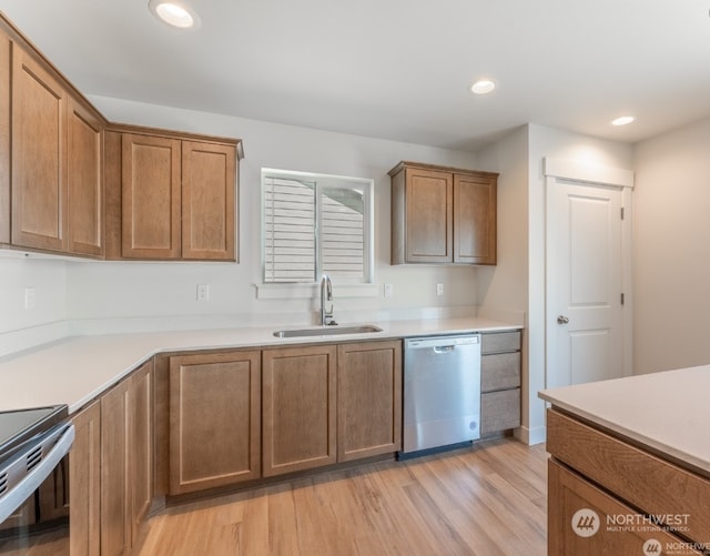 kitchen with range with electric cooktop, sink, stainless steel dishwasher, and light wood-type flooring