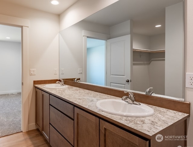 bathroom featuring vanity and hardwood / wood-style flooring