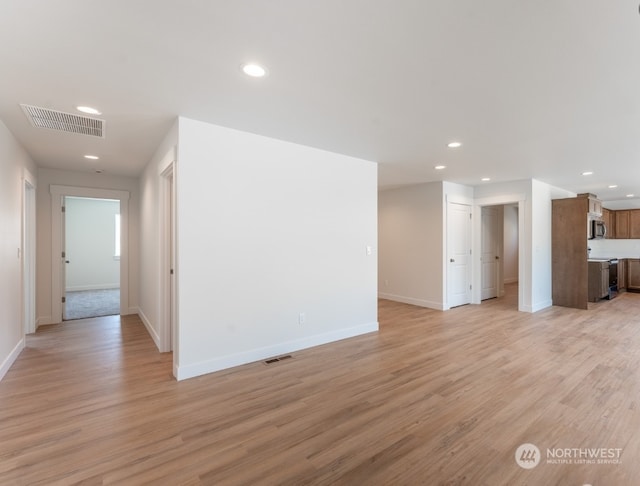 unfurnished living room featuring light wood-type flooring