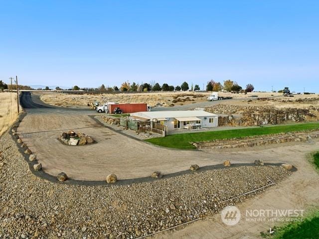 view of yard with a rural view