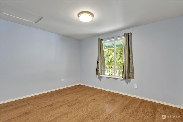 spare room featuring light hardwood / wood-style floors