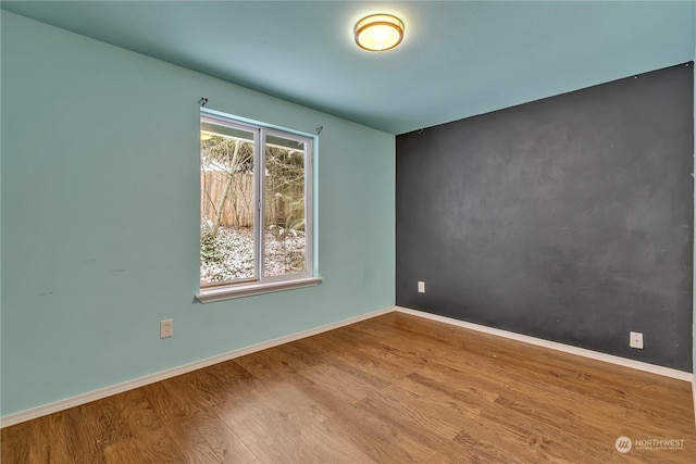 empty room featuring hardwood / wood-style floors