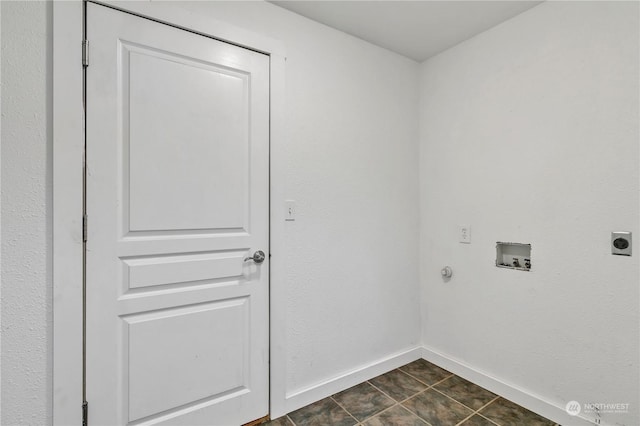 laundry area featuring hookup for a washing machine, hookup for an electric dryer, and dark tile patterned floors