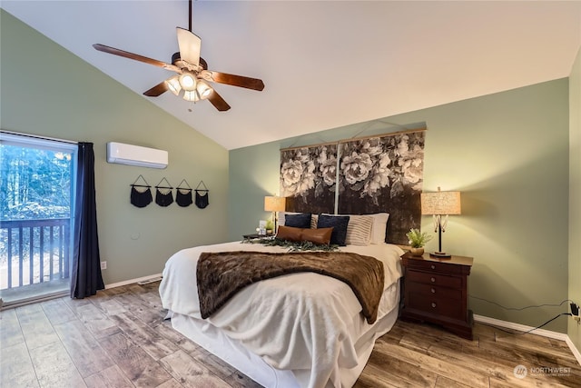 bedroom with access to outside, wood-type flooring, an AC wall unit, and vaulted ceiling