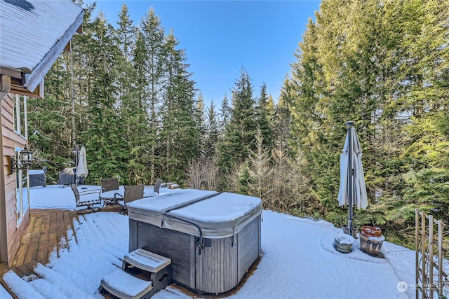 view of yard featuring a wooden deck and a hot tub