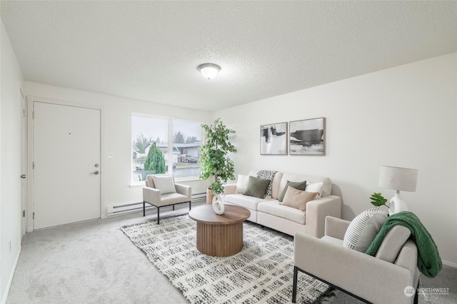 living room with carpet flooring, a textured ceiling, and a baseboard heating unit