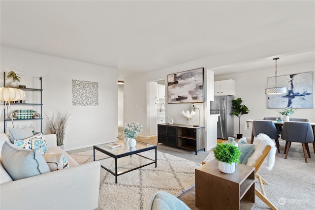 living room featuring light colored carpet