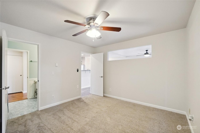 unfurnished bedroom featuring light colored carpet and ceiling fan