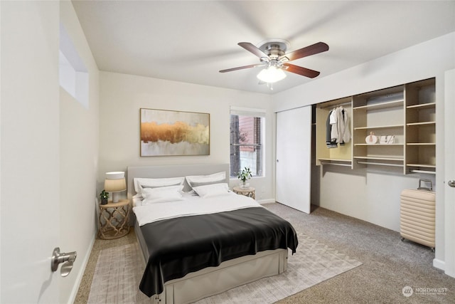 carpeted bedroom with a closet and ceiling fan