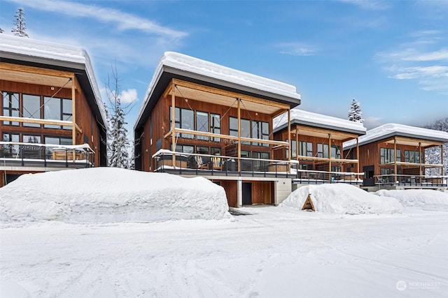 view of snow covered house