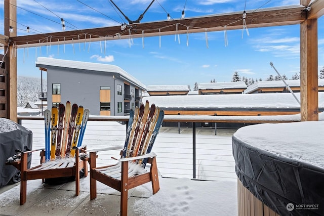 snow covered patio featuring area for grilling