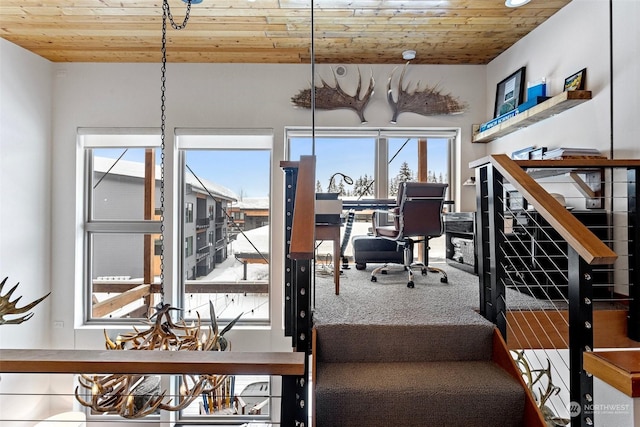 dining area with wood ceiling and carpet floors