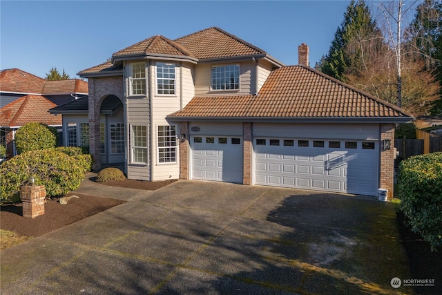 mediterranean / spanish-style home featuring a garage