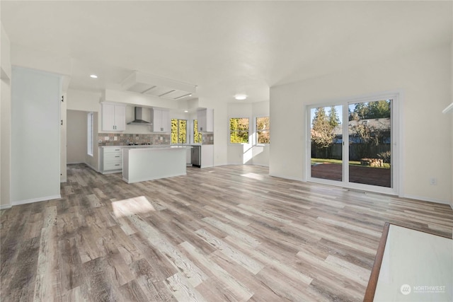 unfurnished living room featuring light hardwood / wood-style flooring