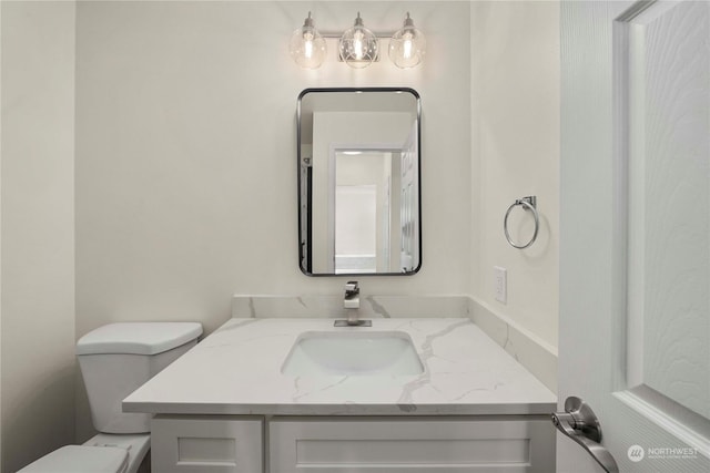 bathroom with vanity and toilet