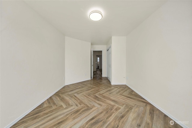 empty room featuring light parquet flooring