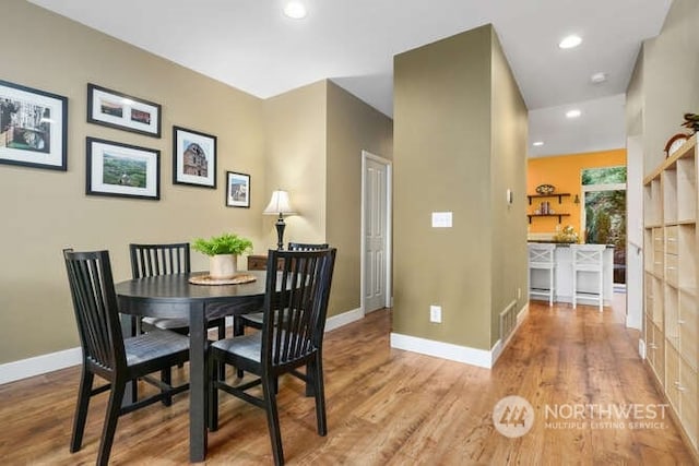 dining space featuring light hardwood / wood-style floors