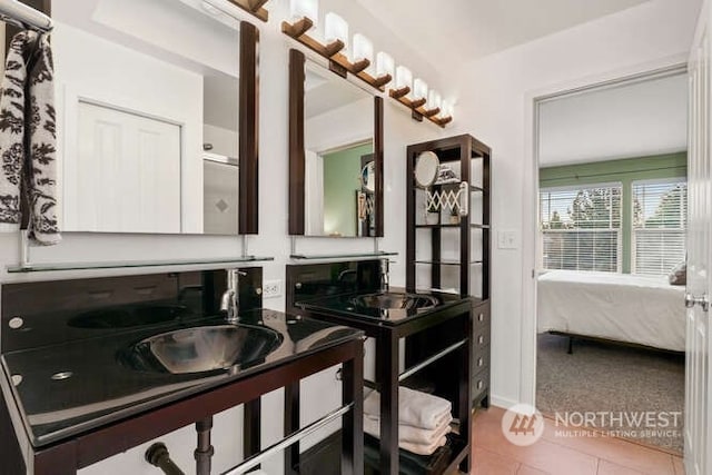 bathroom with sink and tile patterned floors