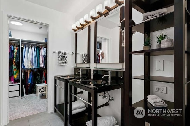 bathroom featuring tile patterned floors and sink