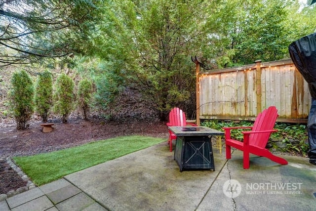 view of patio with an outdoor fire pit