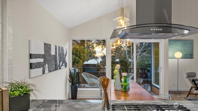 dining space featuring lofted ceiling and a chandelier