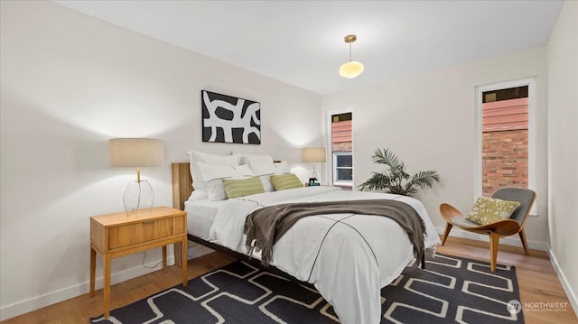 bedroom with hardwood / wood-style floors