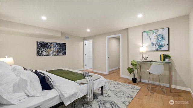 bedroom with light hardwood / wood-style floors