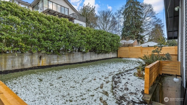 view of yard covered in snow