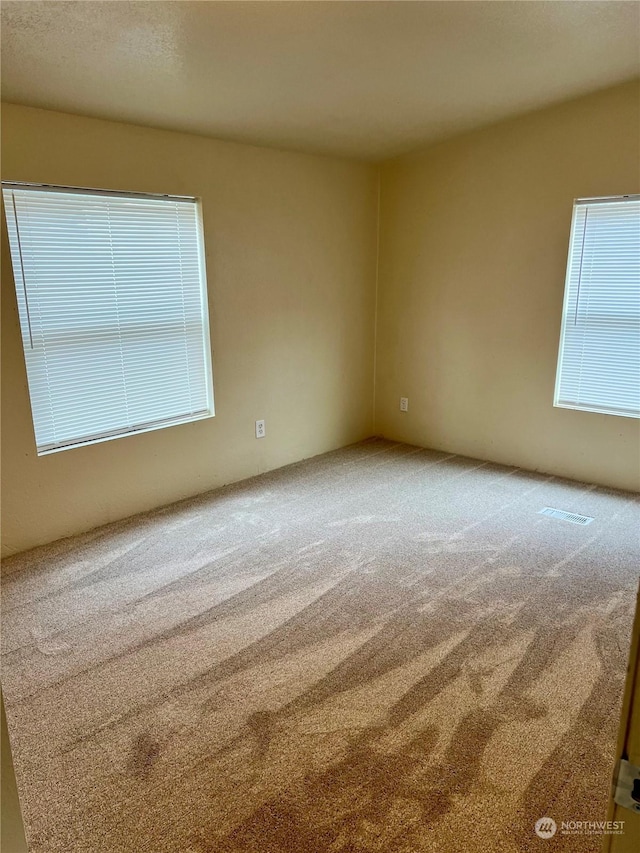 empty room with carpet flooring