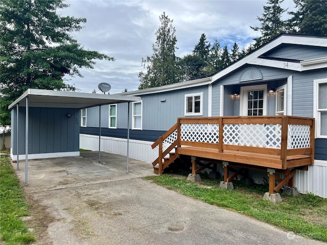 back of house with a carport