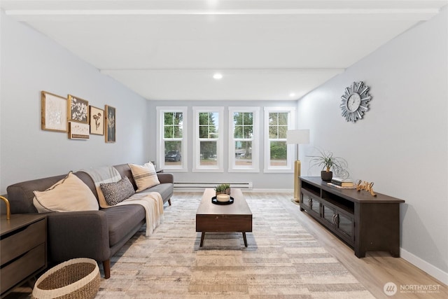 living room with light wood-type flooring, a baseboard radiator, baseboards, and recessed lighting