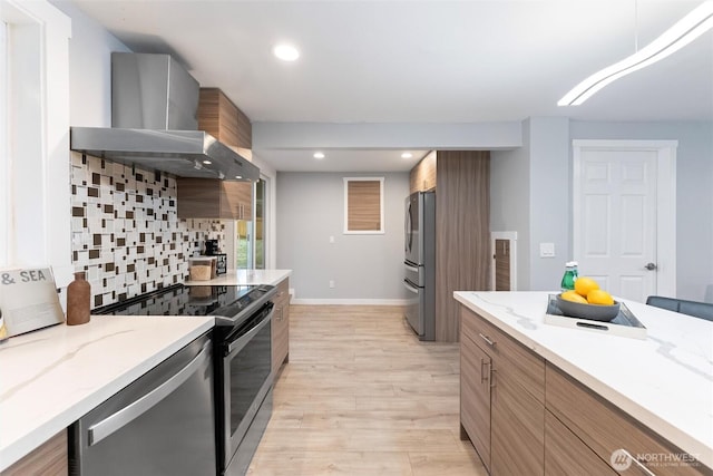 kitchen featuring range with electric stovetop, wall chimney exhaust hood, freestanding refrigerator, backsplash, and recessed lighting