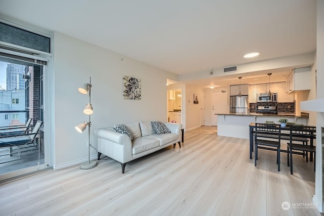 living room featuring light wood-type flooring