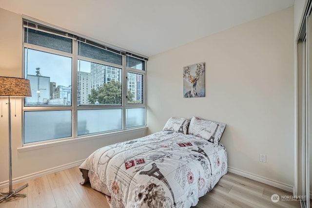 bedroom with hardwood / wood-style floors